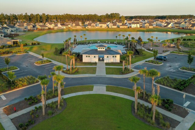 aerial view at dusk with a water view