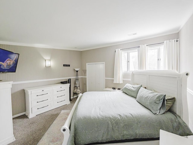 bedroom featuring carpet floors and crown molding