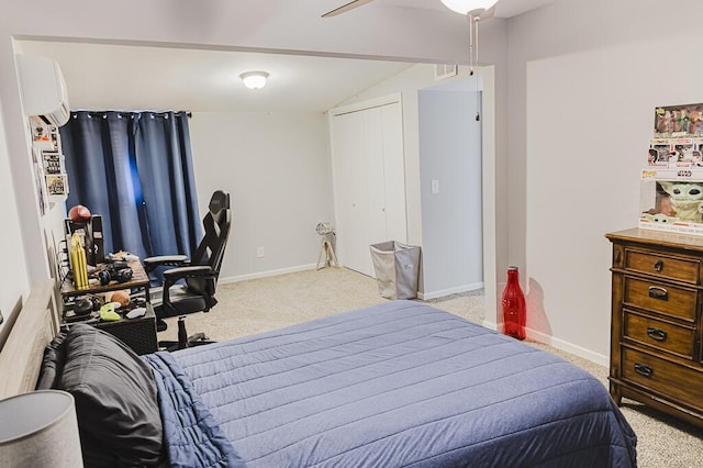 carpeted bedroom featuring ceiling fan, a wall mounted AC, and vaulted ceiling