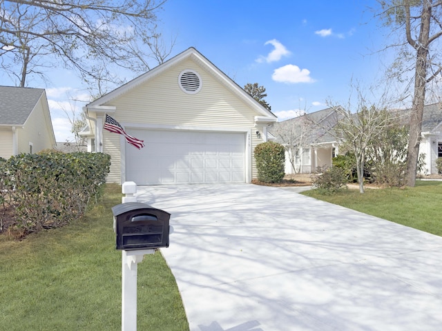 ranch-style home with driveway, an attached garage, and a front lawn