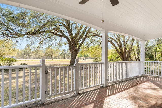 exterior space featuring ceiling fan