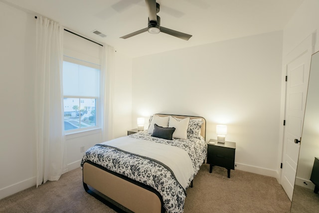 bedroom with light colored carpet and ceiling fan