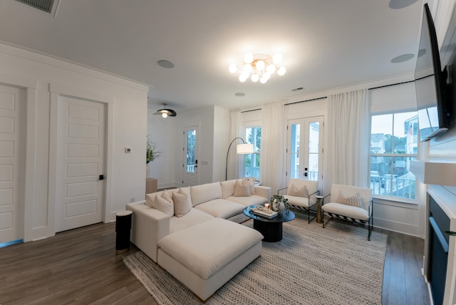 living room featuring dark hardwood / wood-style flooring and french doors