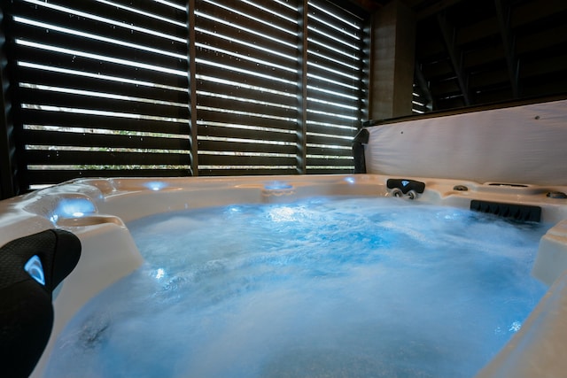 view of pool featuring a hot tub