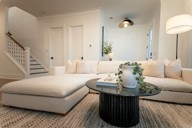 living room featuring crown molding