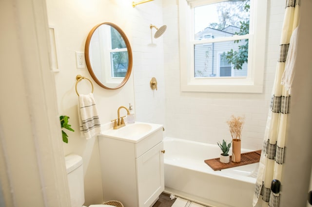 full bathroom featuring vanity, toilet, and shower / tub combo