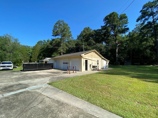 view of side of property with a yard