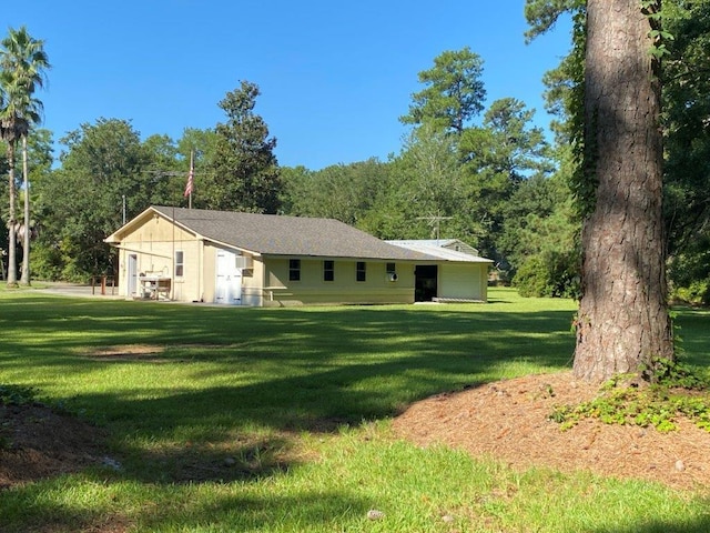 back of property featuring a lawn