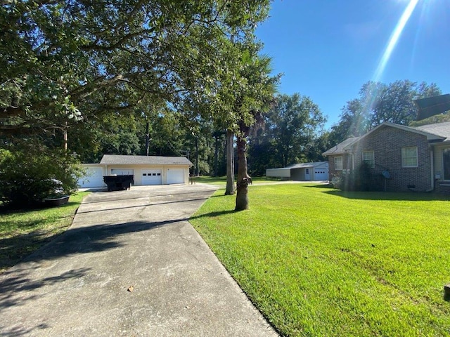 view of yard with a garage