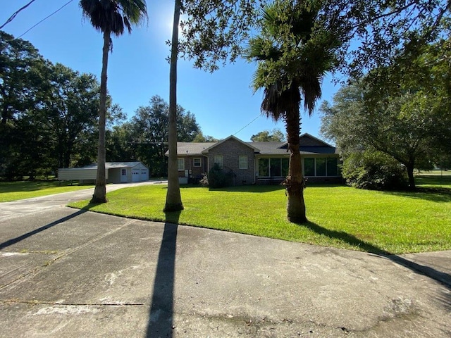 ranch-style home featuring a front yard