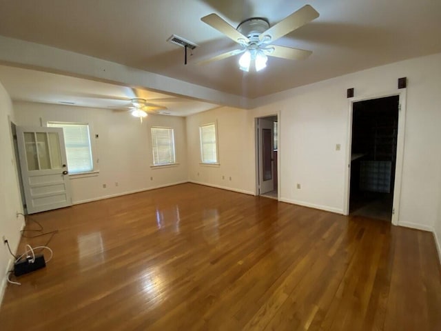 unfurnished bedroom featuring dark hardwood / wood-style flooring