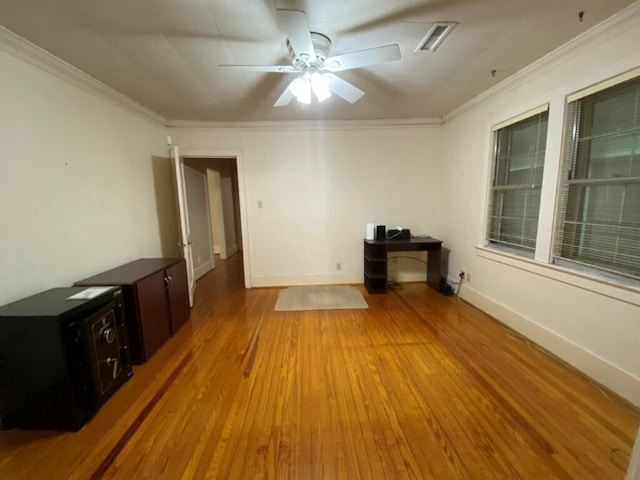 unfurnished living room featuring ceiling fan, ornamental molding, and light hardwood / wood-style flooring