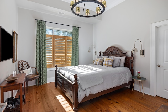 bedroom with hardwood / wood-style floors