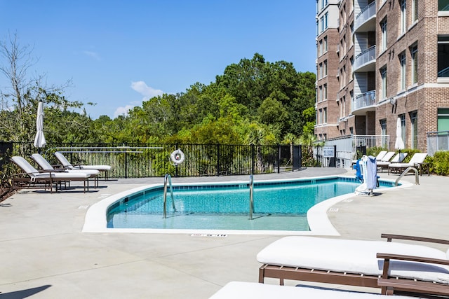 view of swimming pool with a patio area