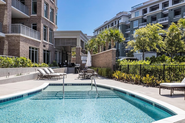 view of swimming pool featuring a patio area