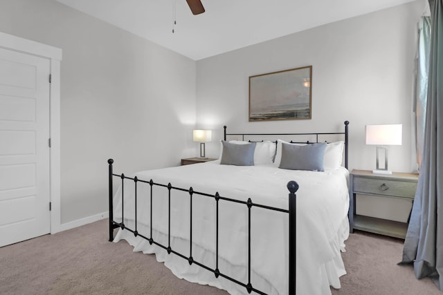 bedroom featuring carpet flooring, a ceiling fan, and baseboards