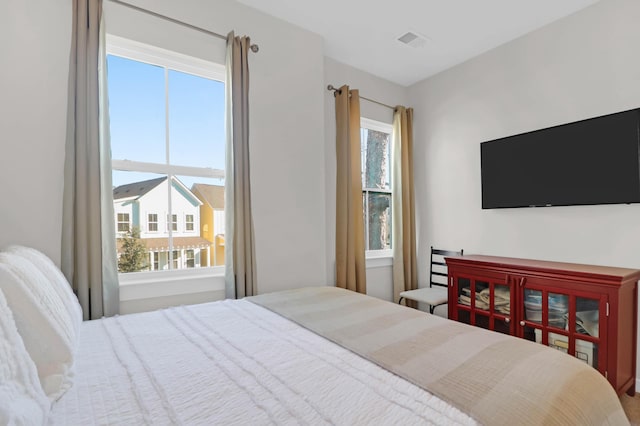 bedroom featuring visible vents