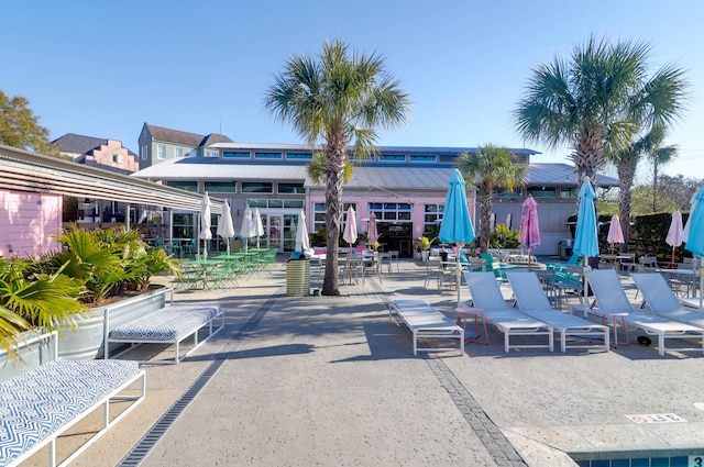 view of property's community with a patio