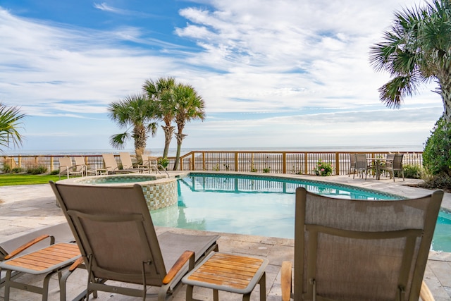 view of swimming pool with an in ground hot tub and a patio