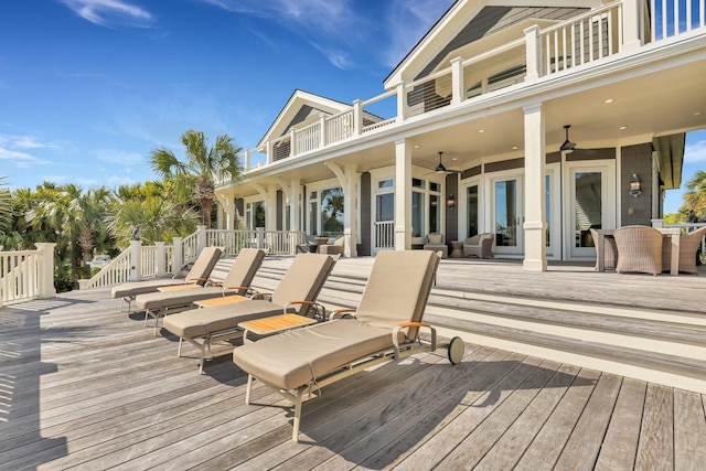 wooden terrace featuring ceiling fan