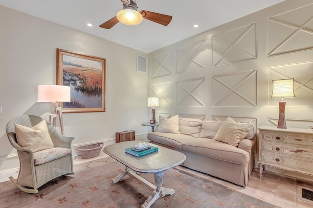 tiled living room with ceiling fan