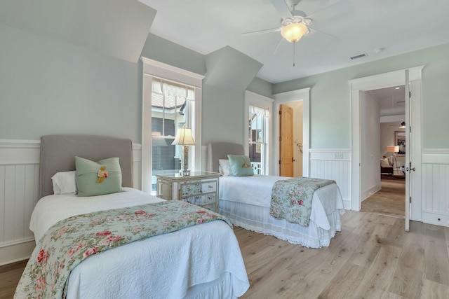 bedroom with ceiling fan and light wood-type flooring