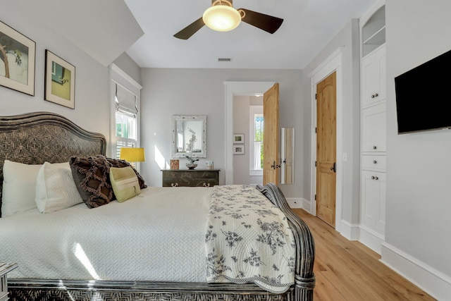 bedroom with ceiling fan and light hardwood / wood-style floors