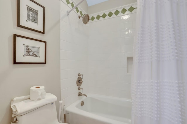 bathroom featuring shower / bath combo with shower curtain and toilet