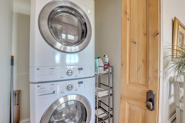 washroom with stacked washer / drying machine