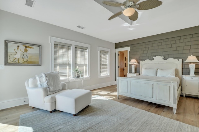 bedroom featuring light hardwood / wood-style flooring and ceiling fan