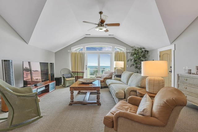 living room with carpet flooring, vaulted ceiling, and ceiling fan