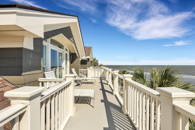 balcony featuring a water view