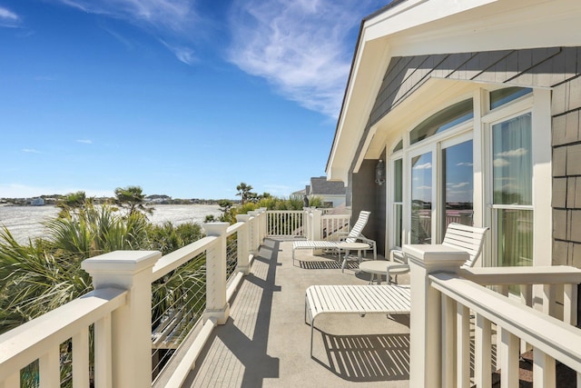 balcony featuring a water view