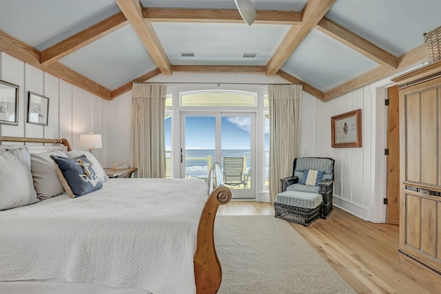 bedroom featuring access to exterior, vaulted ceiling with beams, and light hardwood / wood-style flooring