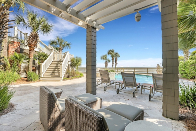 view of patio with a pergola and a fenced in pool