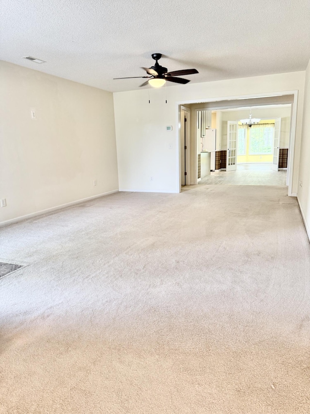 209 Myrtlewood Dr, Santee, SC 29142 - spare room featuring a chandelier, light carpet, a ceiling fan, and a textured ceiling