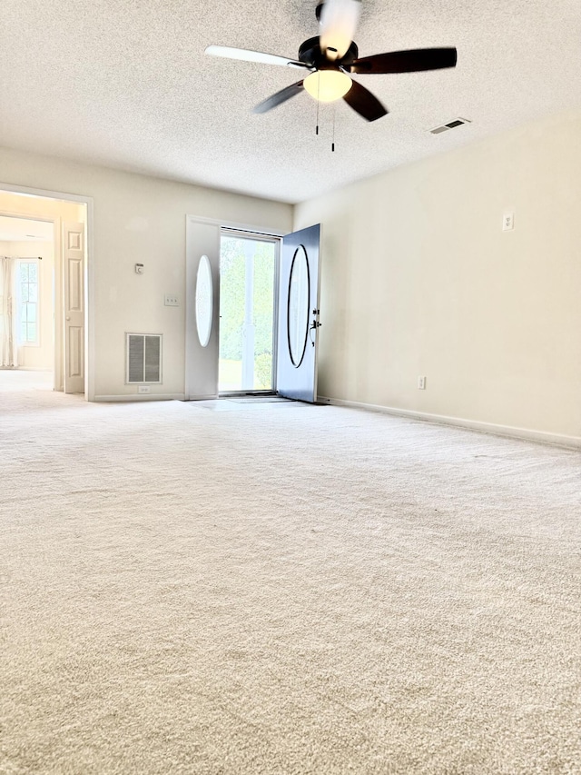 209 Myrtlewood Dr, Santee, SC 29142 - unfurnished living room with carpet, a ceiling fan, and a textured ceiling