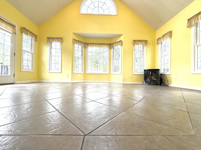 209 Myrtlewood Dr, Santee, SC 29142 - unfurnished living room featuring a wood stove and high vaulted ceiling