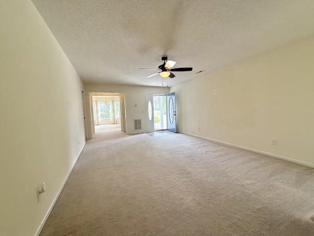 209 Myrtlewood Dr, Santee, SC 29142 - empty room featuring light colored carpet, ceiling fan, and a textured ceiling
