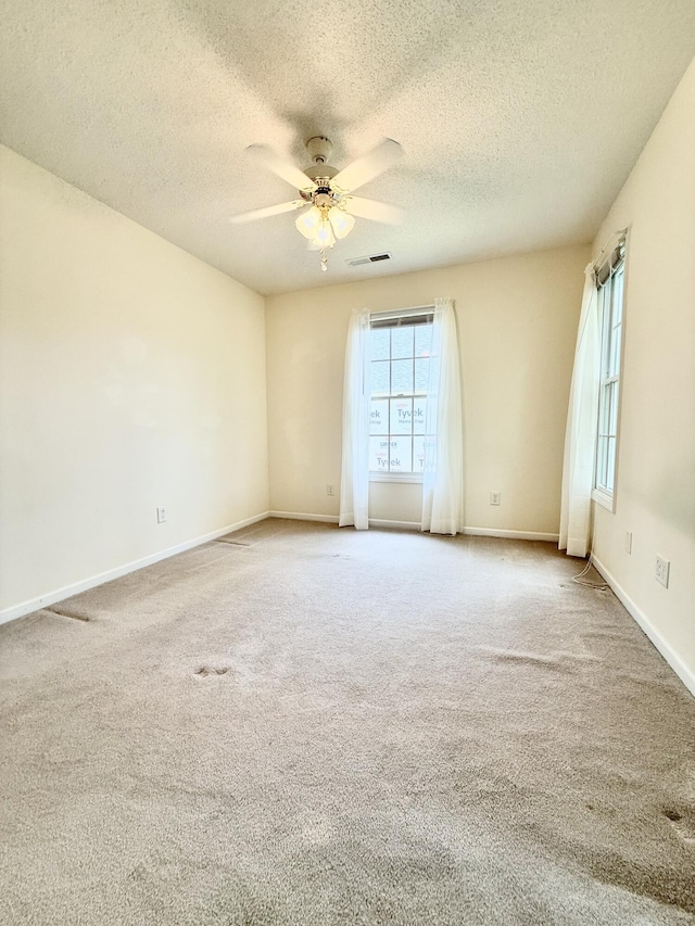 209 Myrtlewood Dr, Santee, SC 29142 - carpeted spare room with plenty of natural light, ceiling fan, and a textured ceiling
