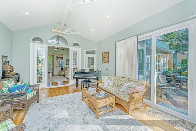 living room with wood finished floors, a ceiling fan, beam ceiling, and high vaulted ceiling
