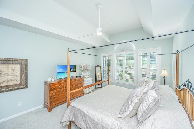 carpeted bedroom featuring baseboards, ceiling fan, and lofted ceiling