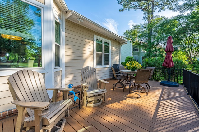 deck with outdoor dining area