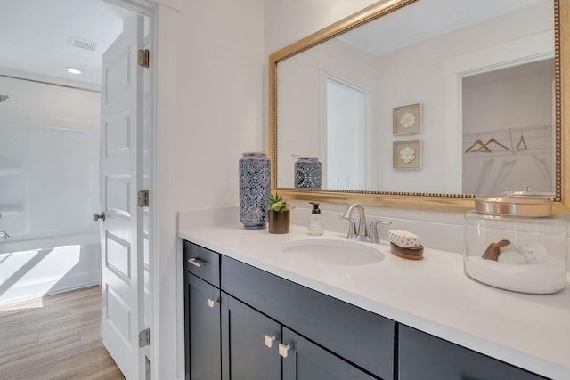 bathroom featuring hardwood / wood-style floors and vanity