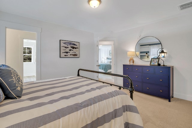 bedroom featuring light colored carpet