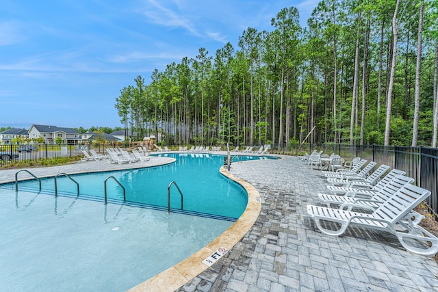 view of pool featuring a patio