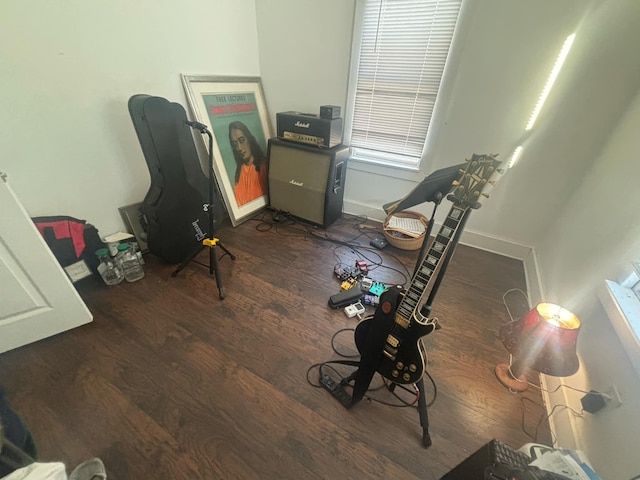 office area featuring baseboards and wood finished floors