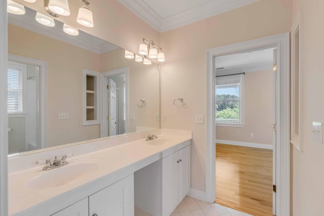 bathroom with ornamental molding, hardwood / wood-style floors, and vanity