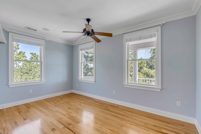 unfurnished room with ceiling fan and a wealth of natural light