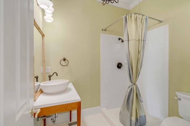 bathroom featuring walk in shower, ornamental molding, sink, and toilet